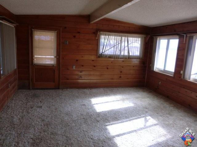 9312 Kemper Road Mojave, CA 93501 - Photo 3 of 14 an empty room with windows