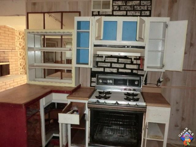 9312 Kemper Road Mojave, CA 93501 - Photo 6 of 14 a kitchen with a stove and a microwave