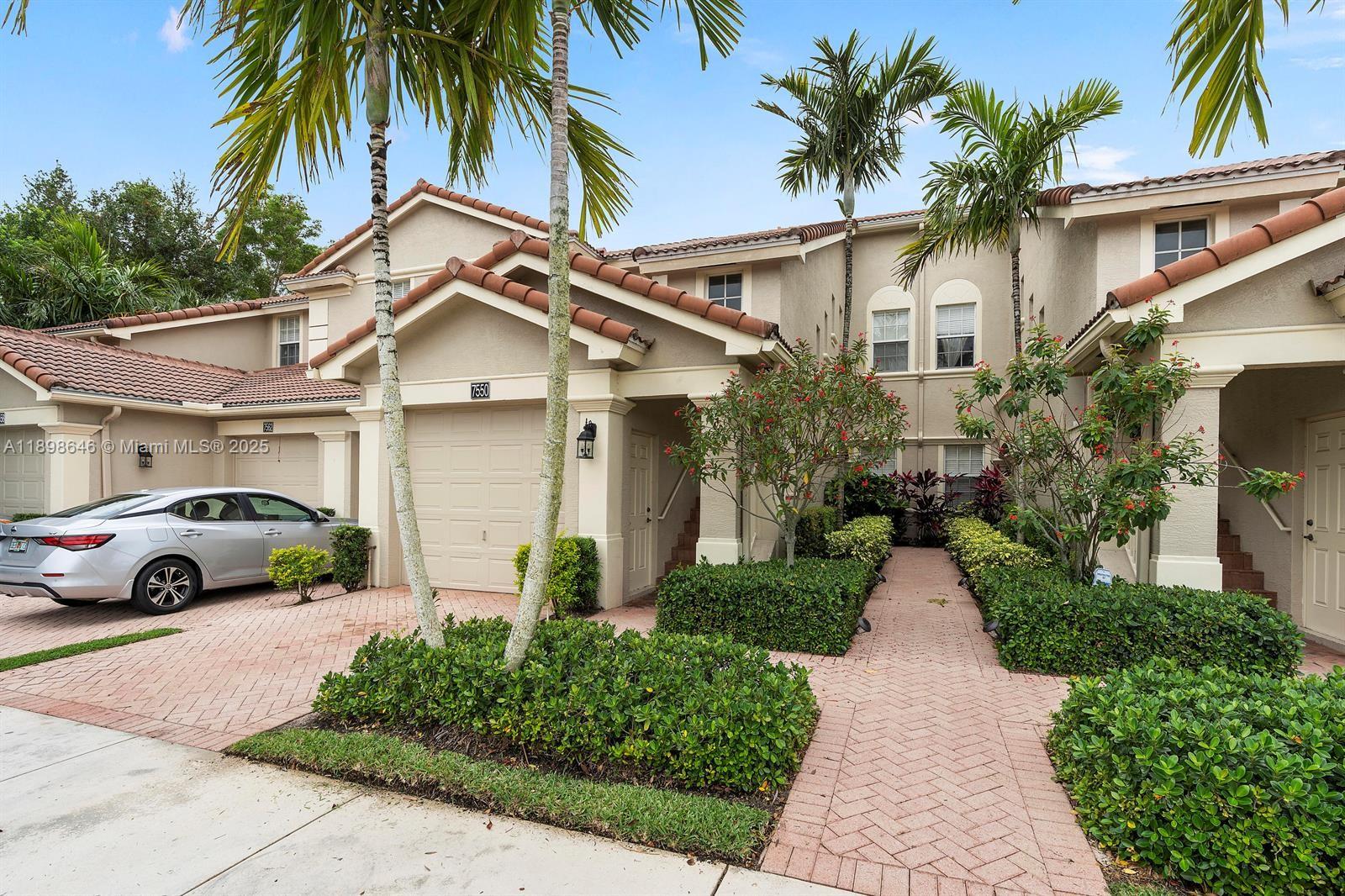 7550 Southwest Herrington Lane, Unit 7550 Stuart, FL 34997 - Photo 1 of 23 a view of a car parked in front of a house