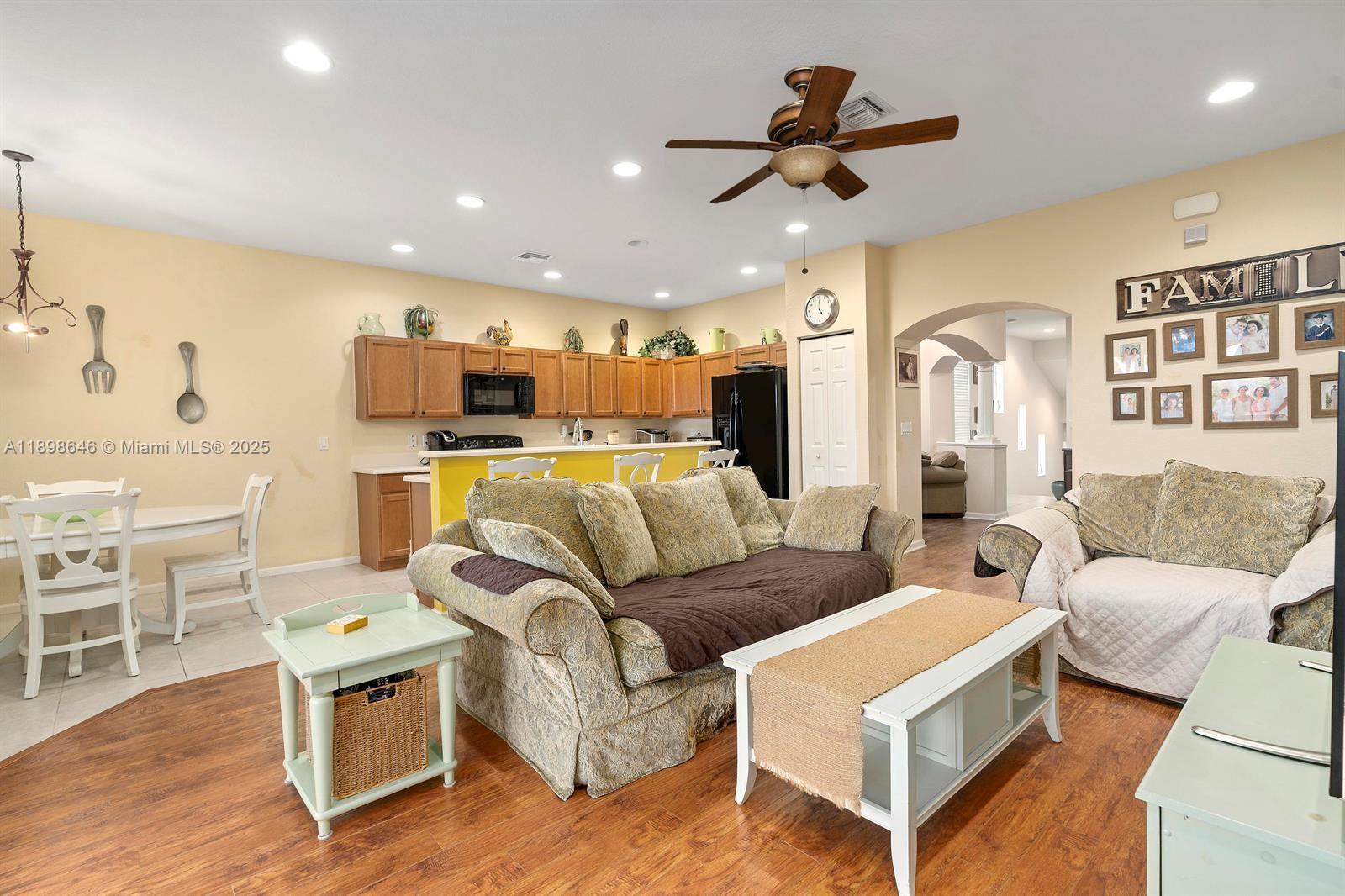 7550 Southwest Herrington Lane, Unit 7550 Stuart, FL 34997 - Photo 15 of 23 a living room with furniture and kitchen view