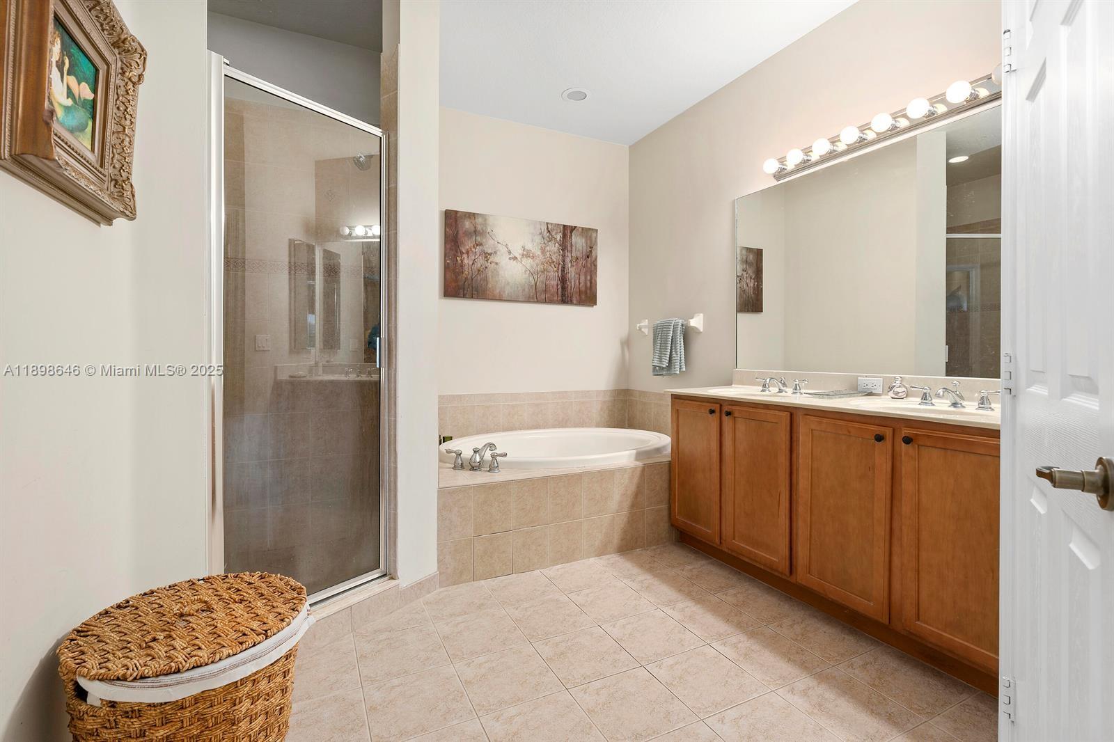 7550 Southwest Herrington Lane, Unit 7550 Stuart, FL 34997 - Photo 19 of 23 a bathroom with a granite countertop sink toilet and shower