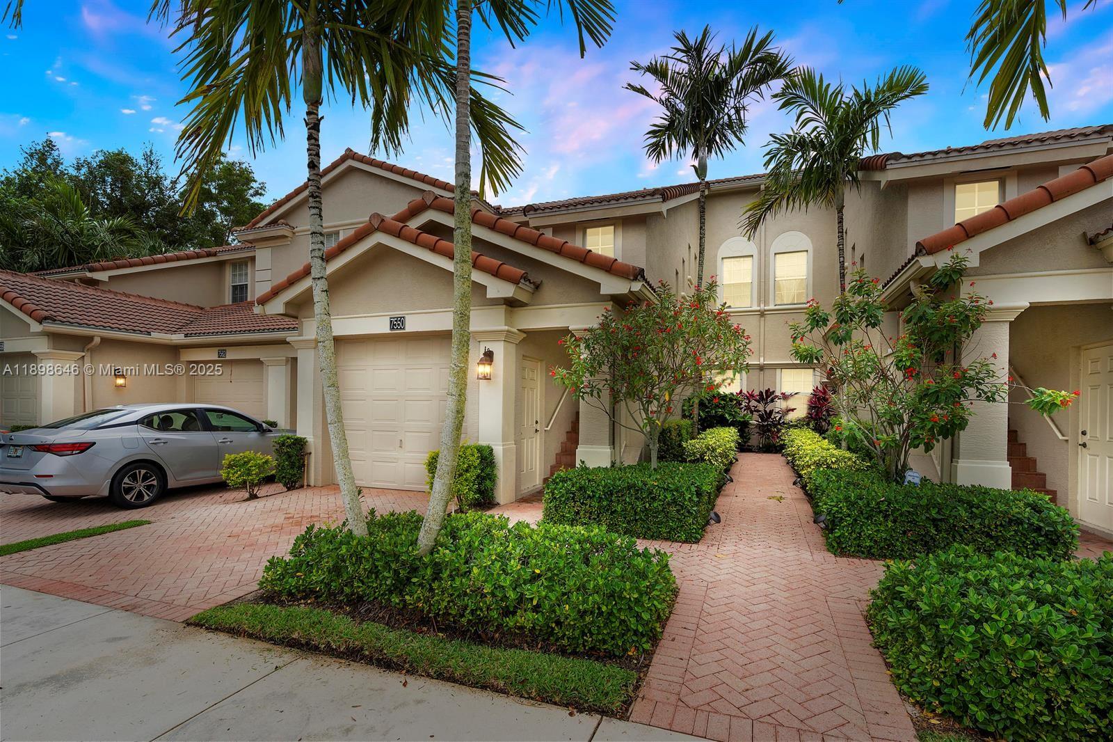 7550 Southwest Herrington Lane, Unit 7550 Stuart, FL 34997 - Photo 23 of 23 a view of a car parked in front of a house