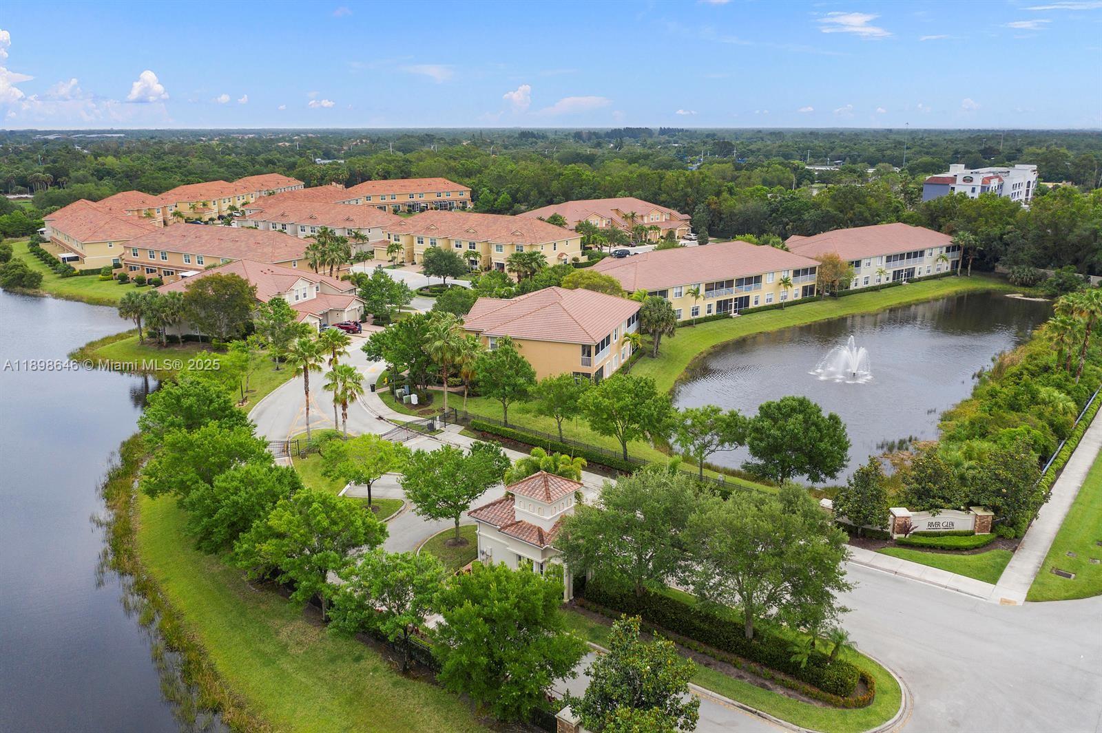 7550 Southwest Herrington Lane, Unit 7550 Stuart, FL 34997 - Photo 3 of 23 an aerial view of residential houses with outdoor space and river