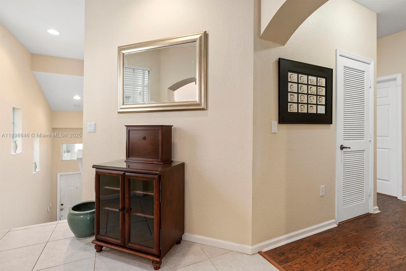 7550 Southwest Herrington Lane, Unit 7550 Stuart, FL 34997 - Photo 6 of 23 a view of an entryway with wooden floor