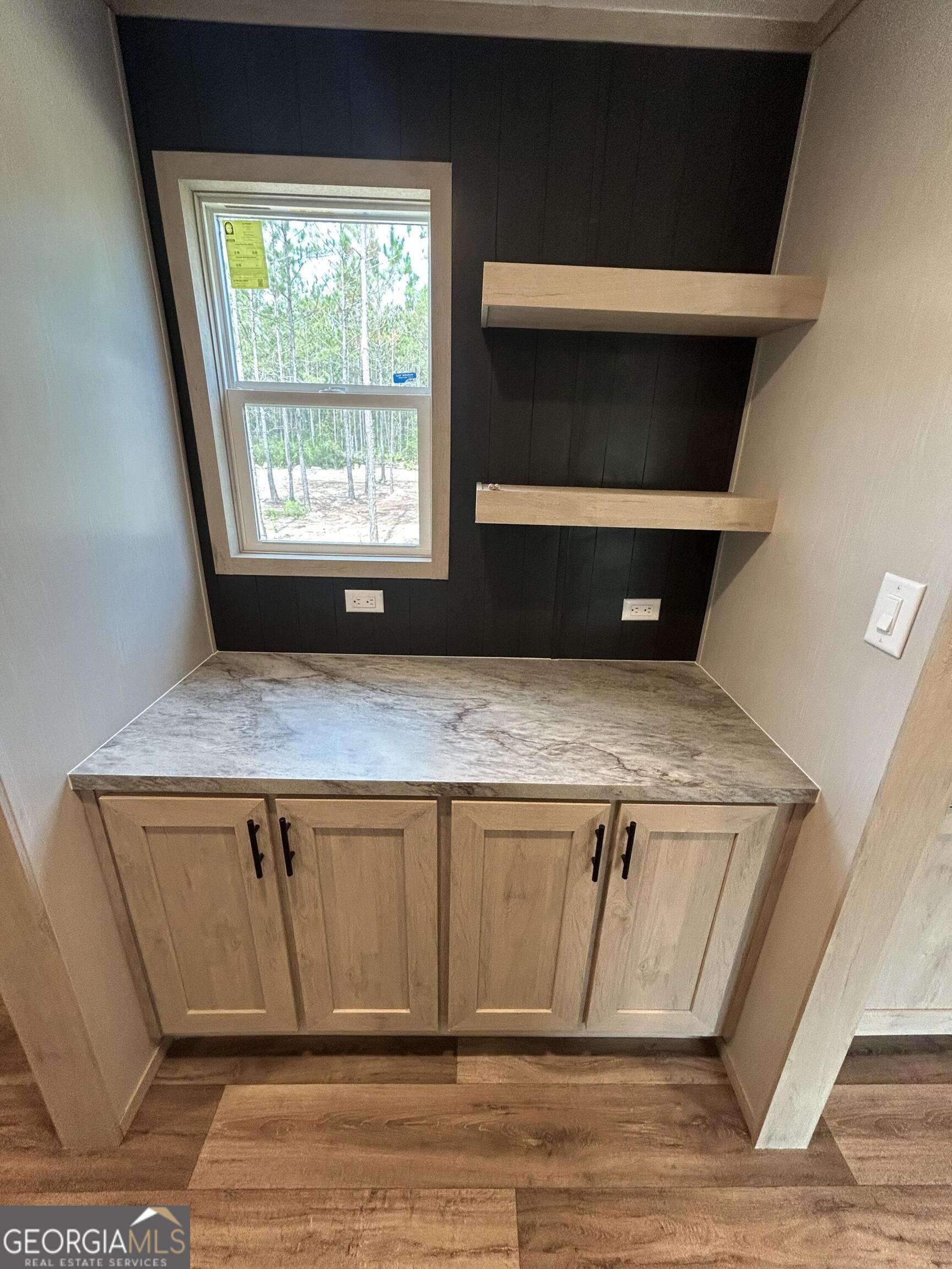 640 Elmer Thrift Road Waycross, GA 31503 - Photo 11 of 23 a view of a kitchen sink dishwasher and a microwave oven