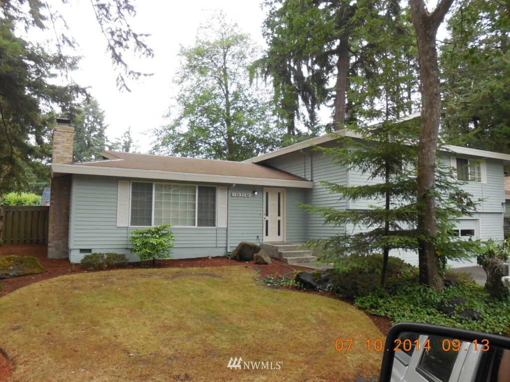8327 Phillips Road Southwest Lakewood, WA 98498 - Photo 1 of 6 a front view of a house with garden