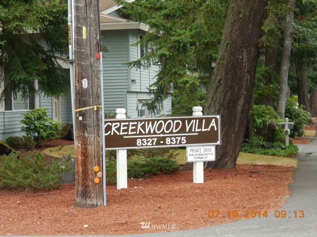 8327 Phillips Road Southwest Lakewood, WA 98498 - Photo 6 of 6 a sign on a pole on a street