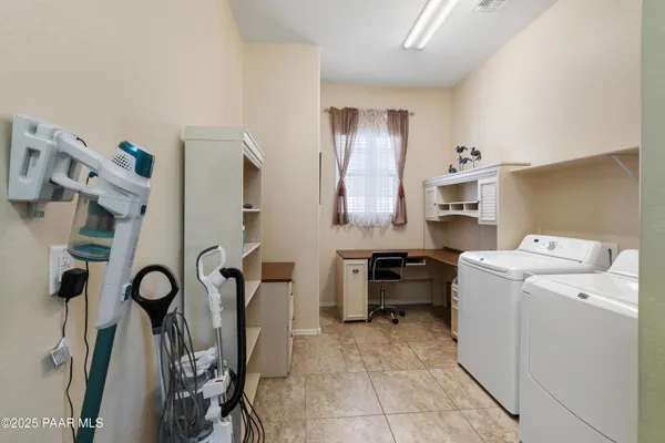 a view of a storage & utility room with washer and dryer