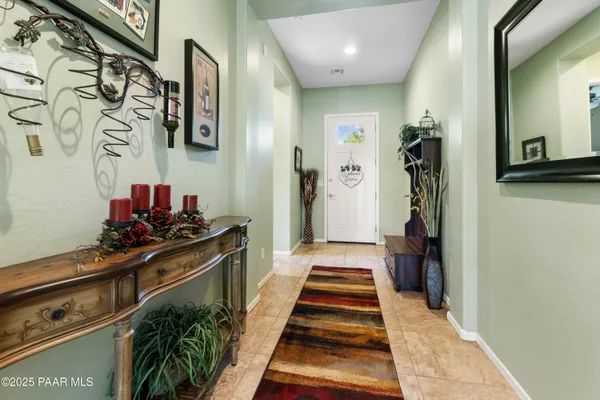 a hallway with a black and white appliances