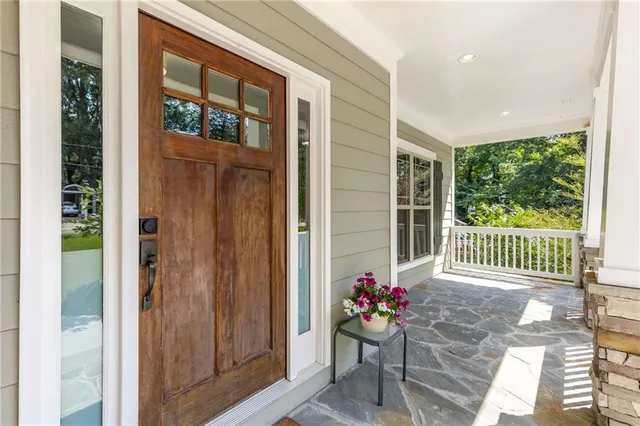 a view of a dining room with furniture wooden floor and a chandelier