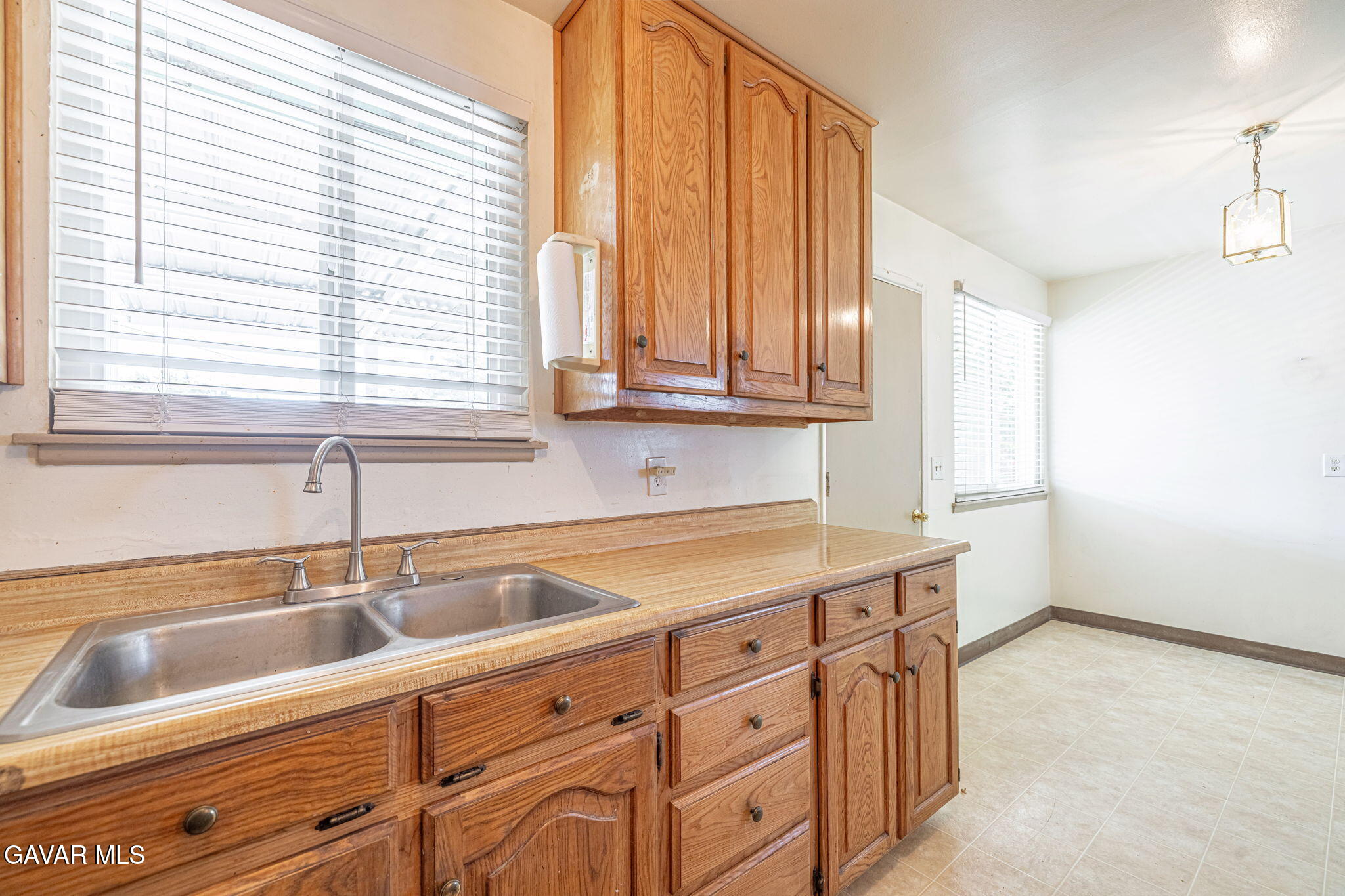 45309 Newtree Avenue Lancaster, CA 93534 - Photo 15 of 35 a kitchen with cabinets appliances and a sink