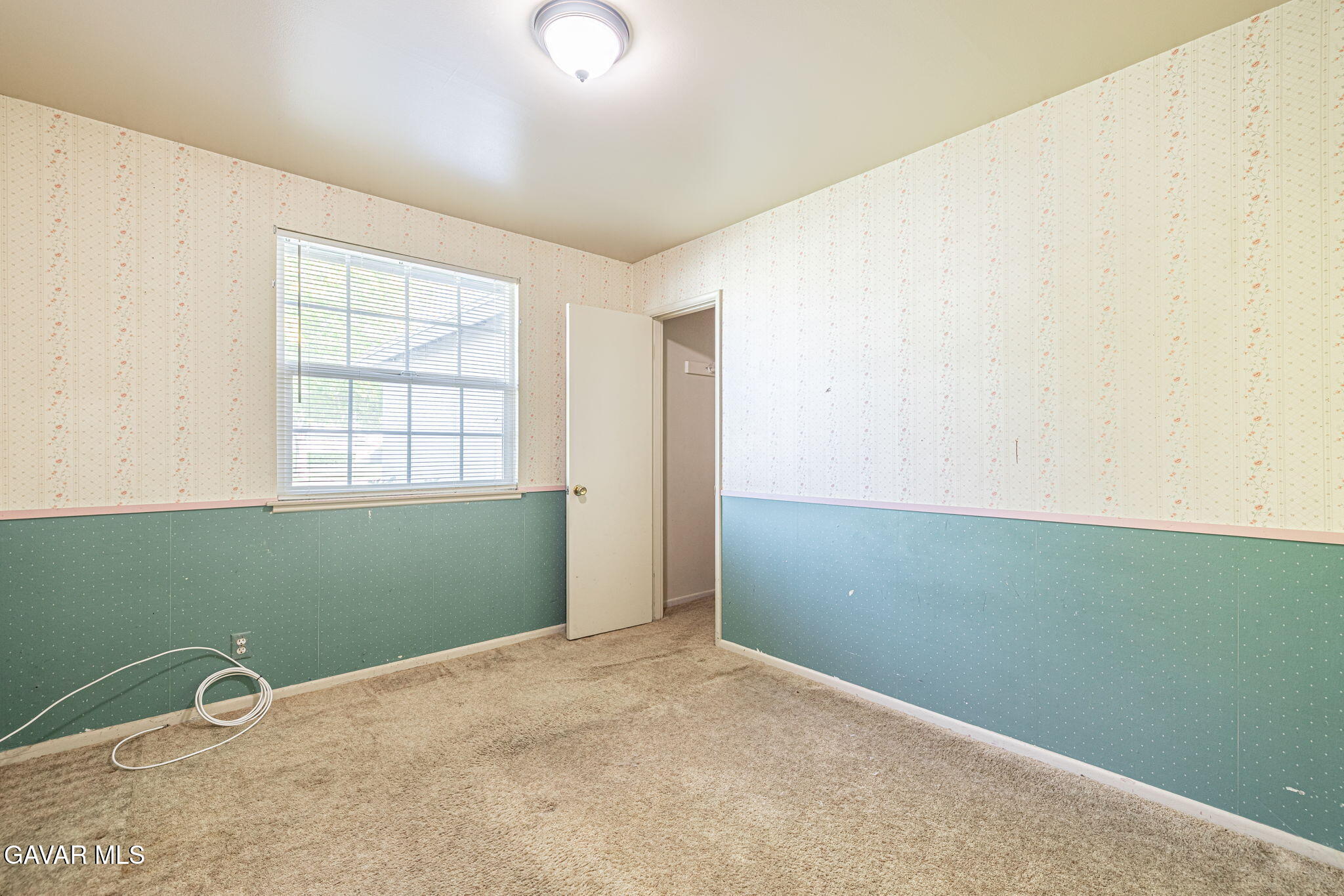 45309 Newtree Avenue Lancaster, CA 93534 - Photo 18 of 35 an empty room with a window and stairs