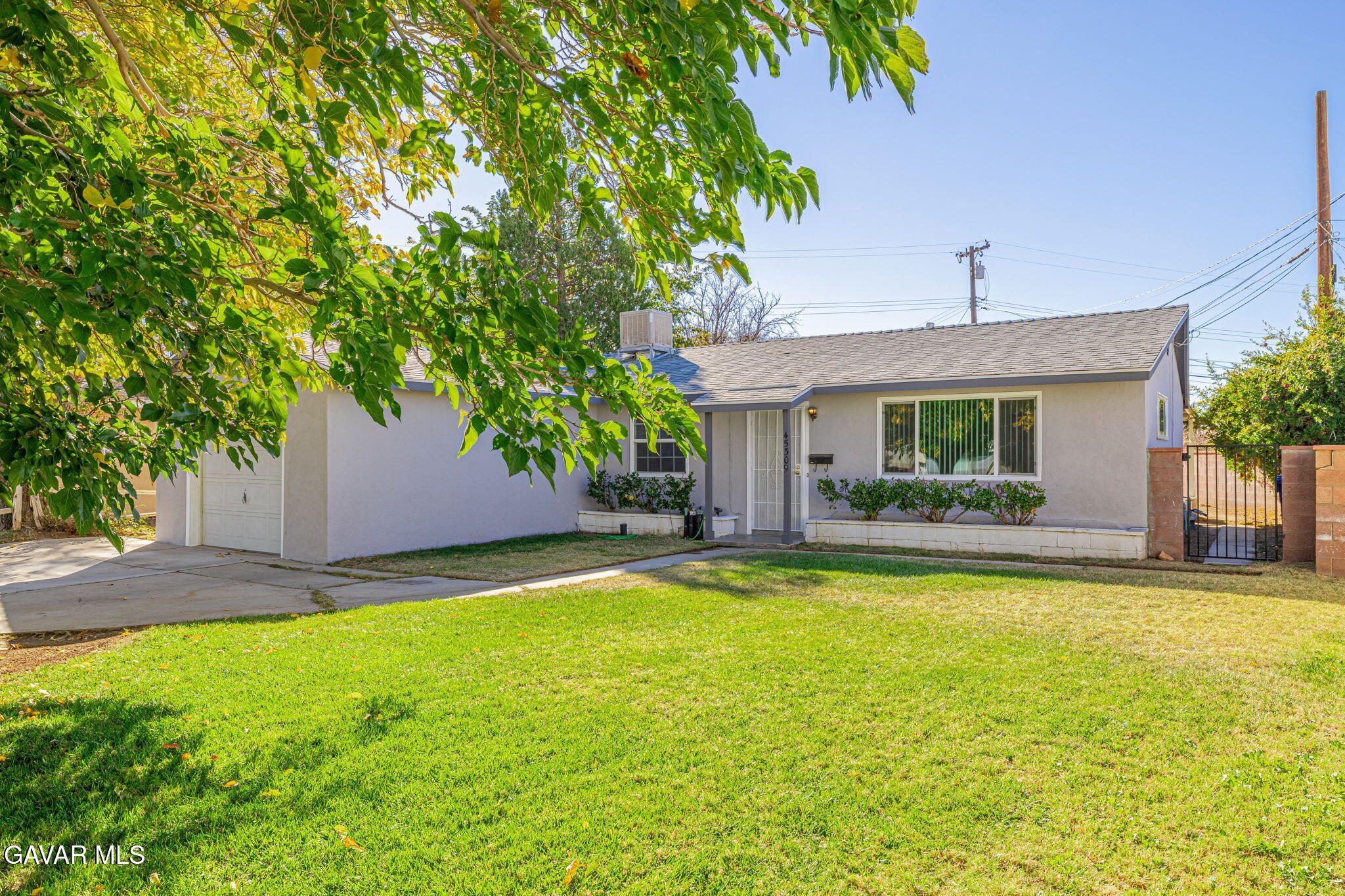 45309 Newtree Avenue Lancaster, CA 93534 - Photo 2 of 35 a view of a house with swimming pool and a porch