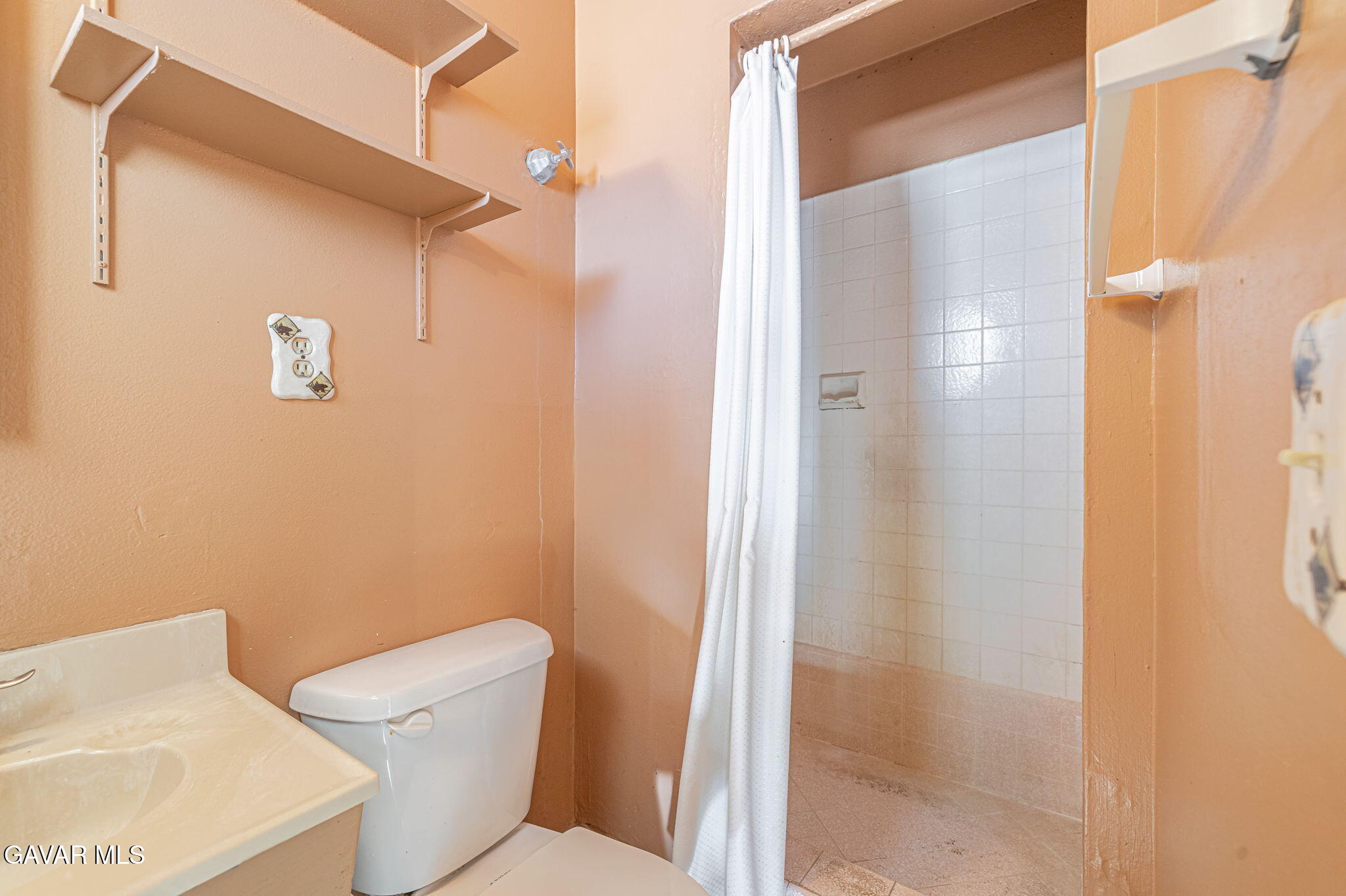 45309 Newtree Avenue Lancaster, CA 93534 - Photo 26 of 35 a white toilet sitting next to a bathroom sink