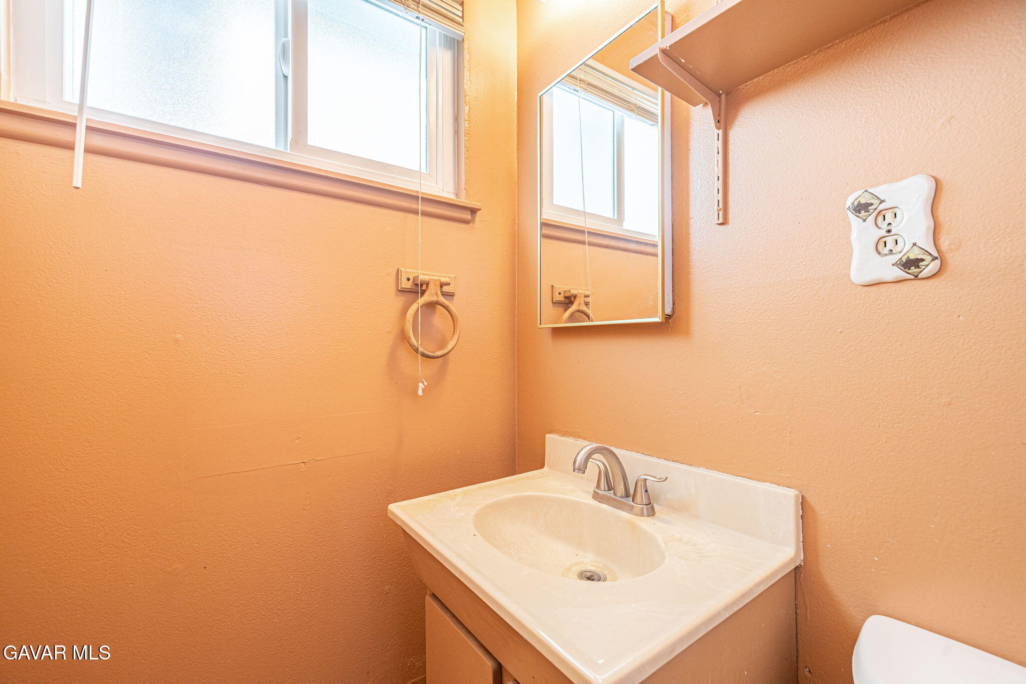 45309 Newtree Avenue Lancaster, CA 93534 - Photo 27 of 35 a bathroom with a sink and a mirror
