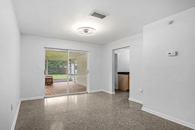 an empty room with large window