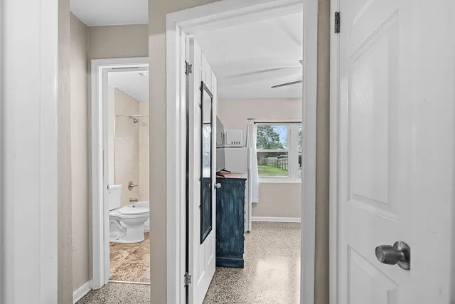 a view of a bathroom from a hallway