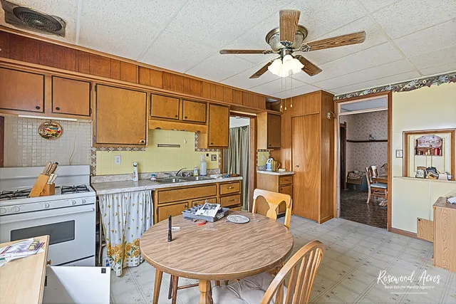 a dining room with furniture and window