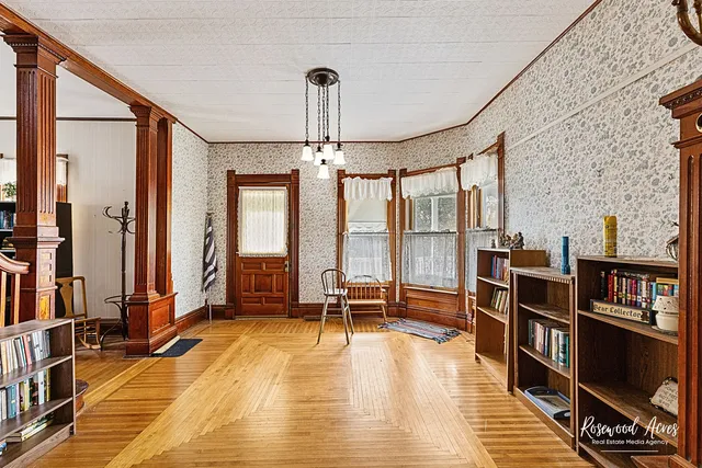 a living room with furniture water view and large windows
