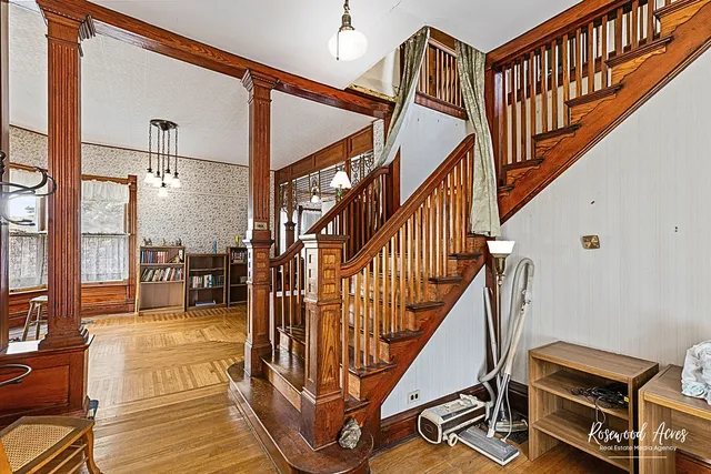 a view of entryway and hall with wooden floor