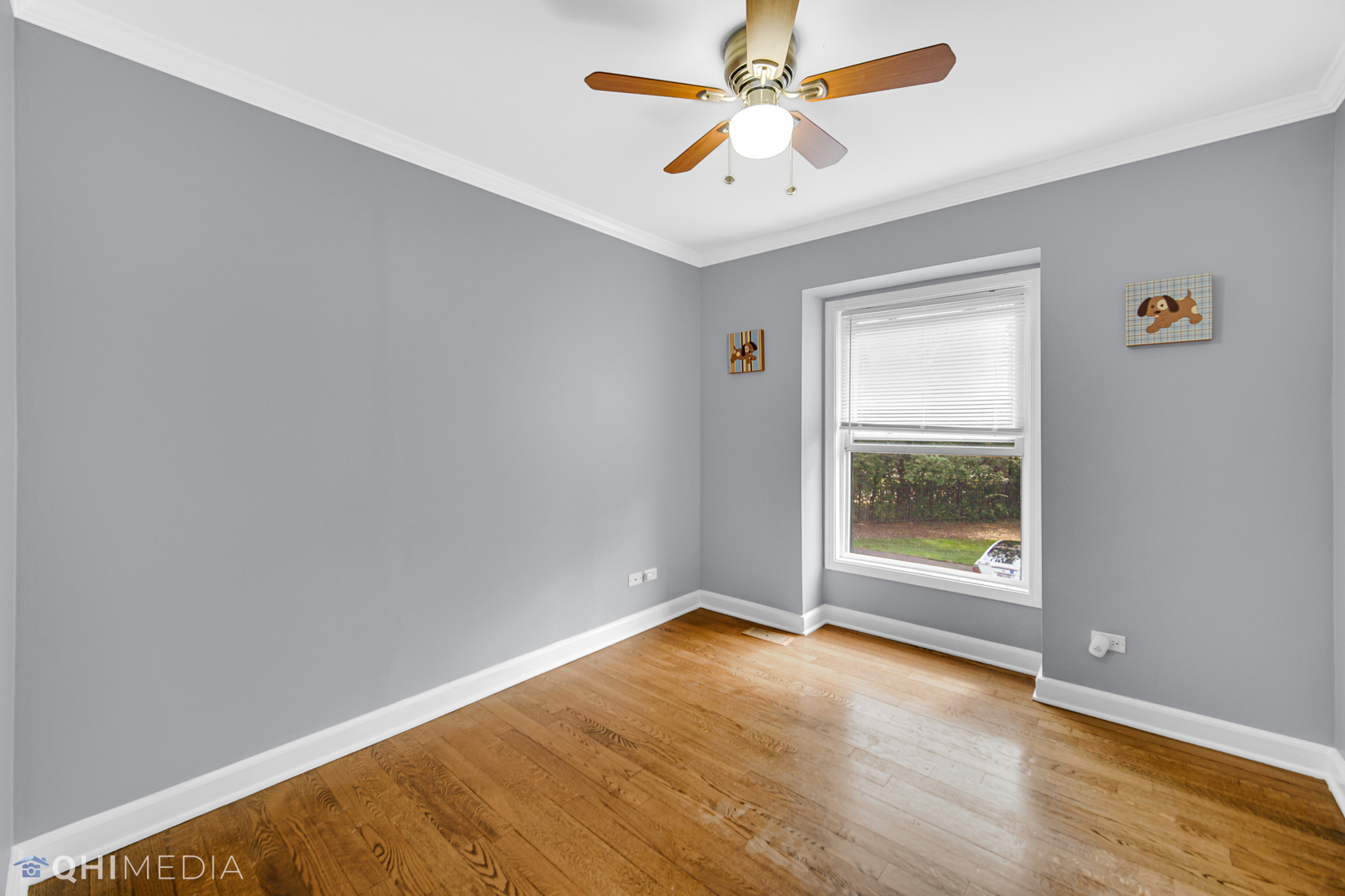 232 Inverrary Lane, Unit 232 Deerfield, IL 60015 - Photo 20 of 27 an empty room with a window and a ceiling fan
