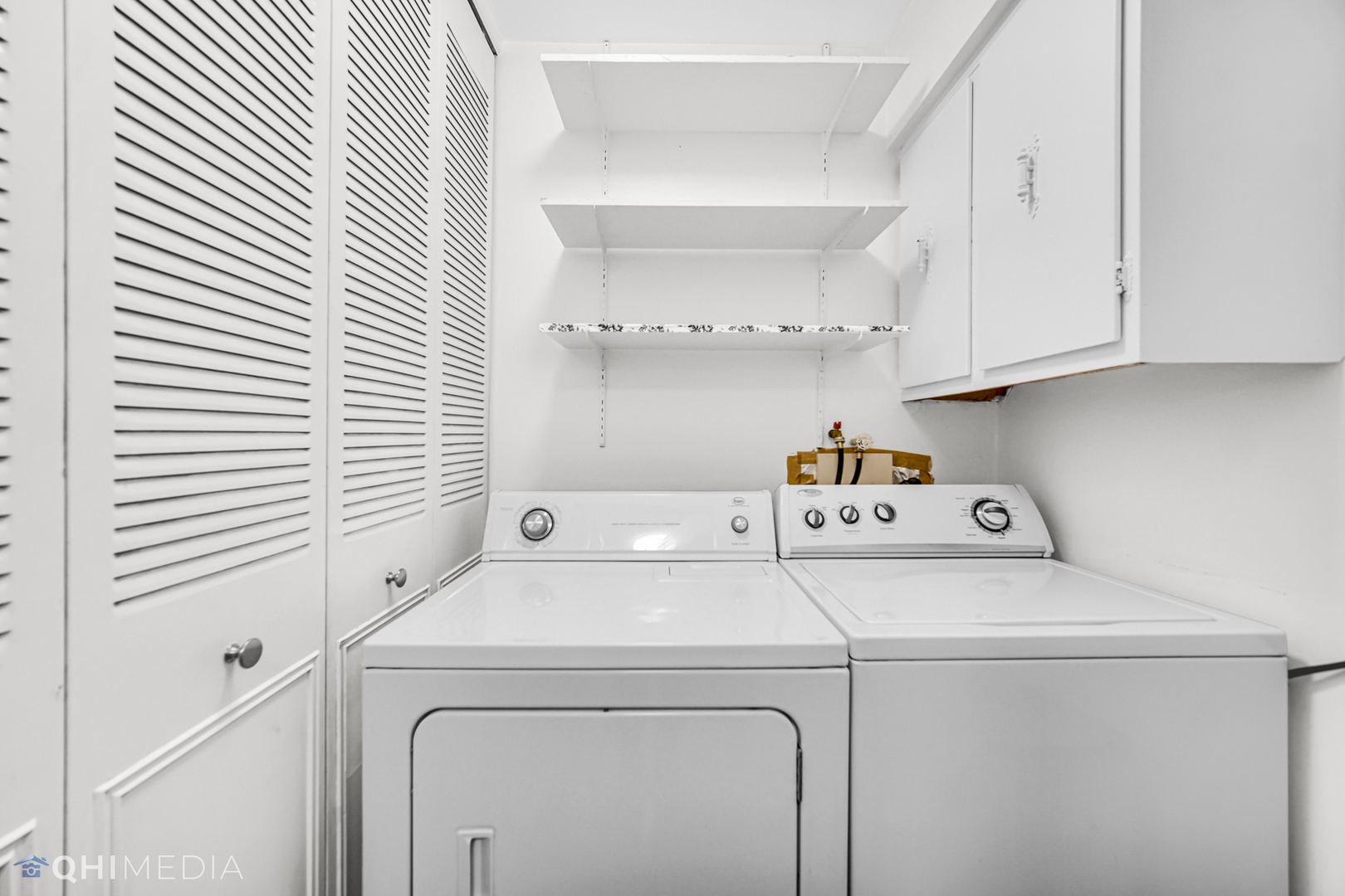 232 Inverrary Lane, Unit 232 Deerfield, IL 60015 - Photo 23 of 27 a utility room with dryer and washer