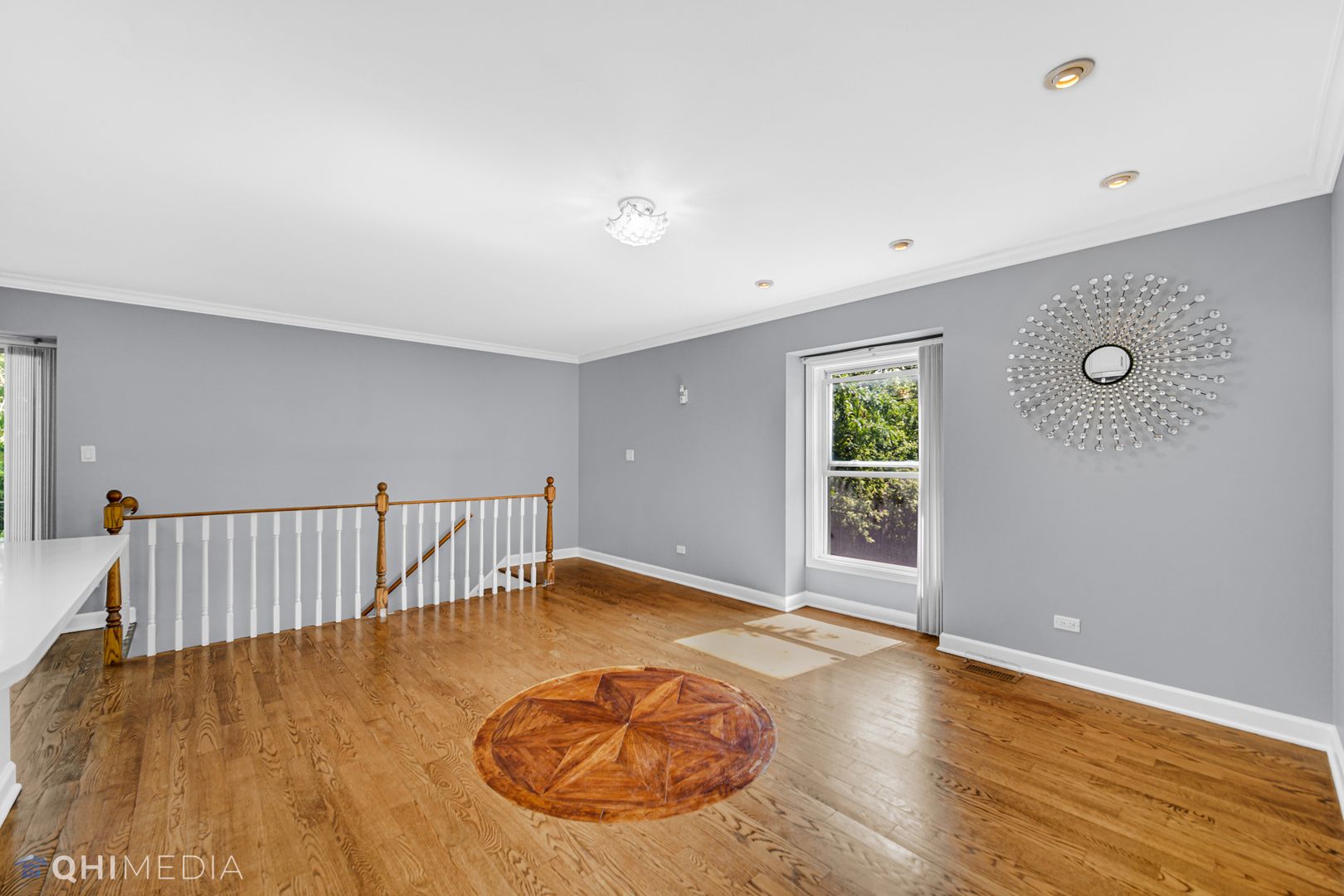232 Inverrary Lane, Unit 232 Deerfield, IL 60015 - Photo 6 of 27 an empty room with wooden floor and windows