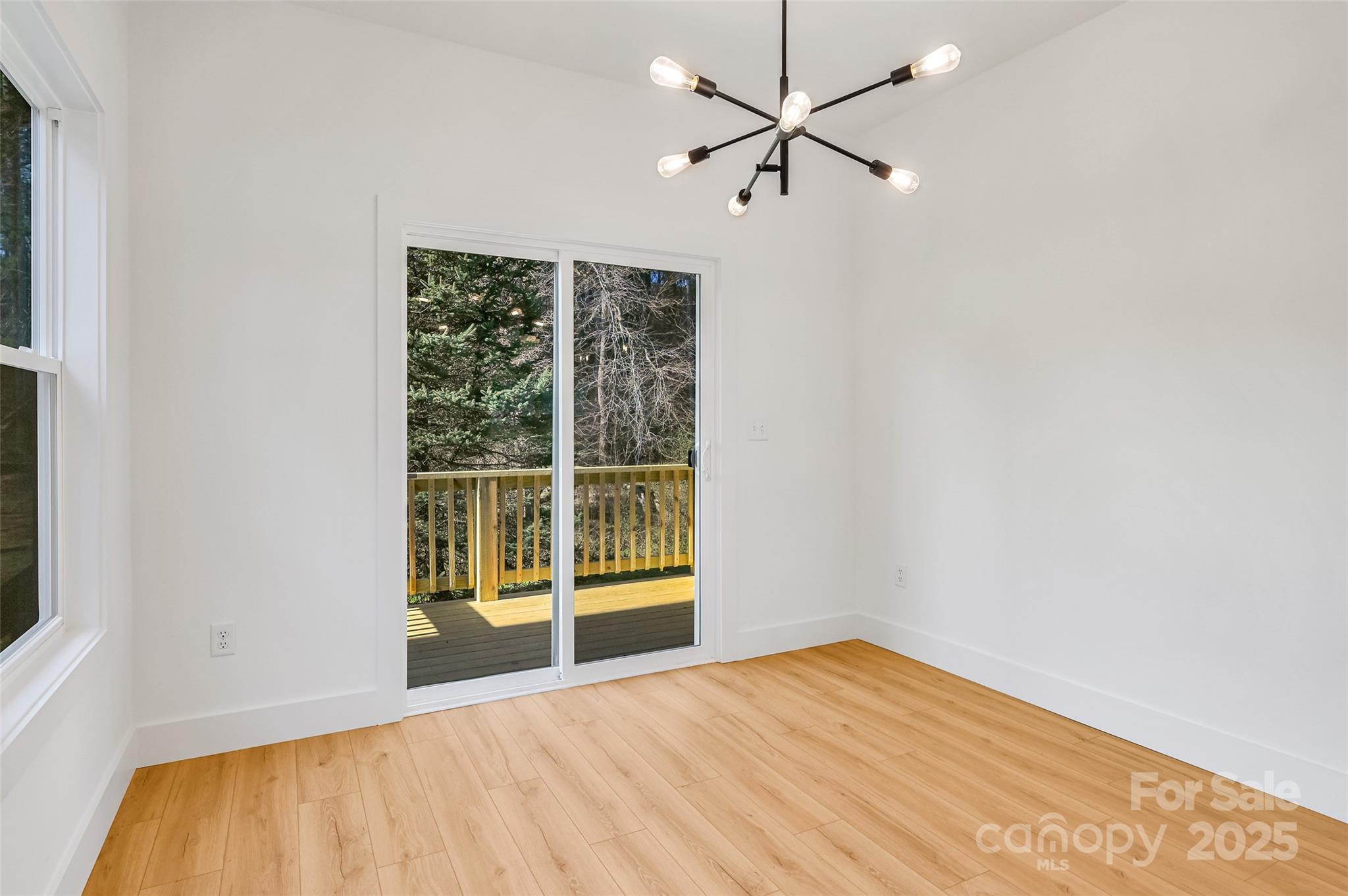 2 Cub Road Asheville, NC 28806 - Photo 11 of 24 wooden floor in an empty room with a window