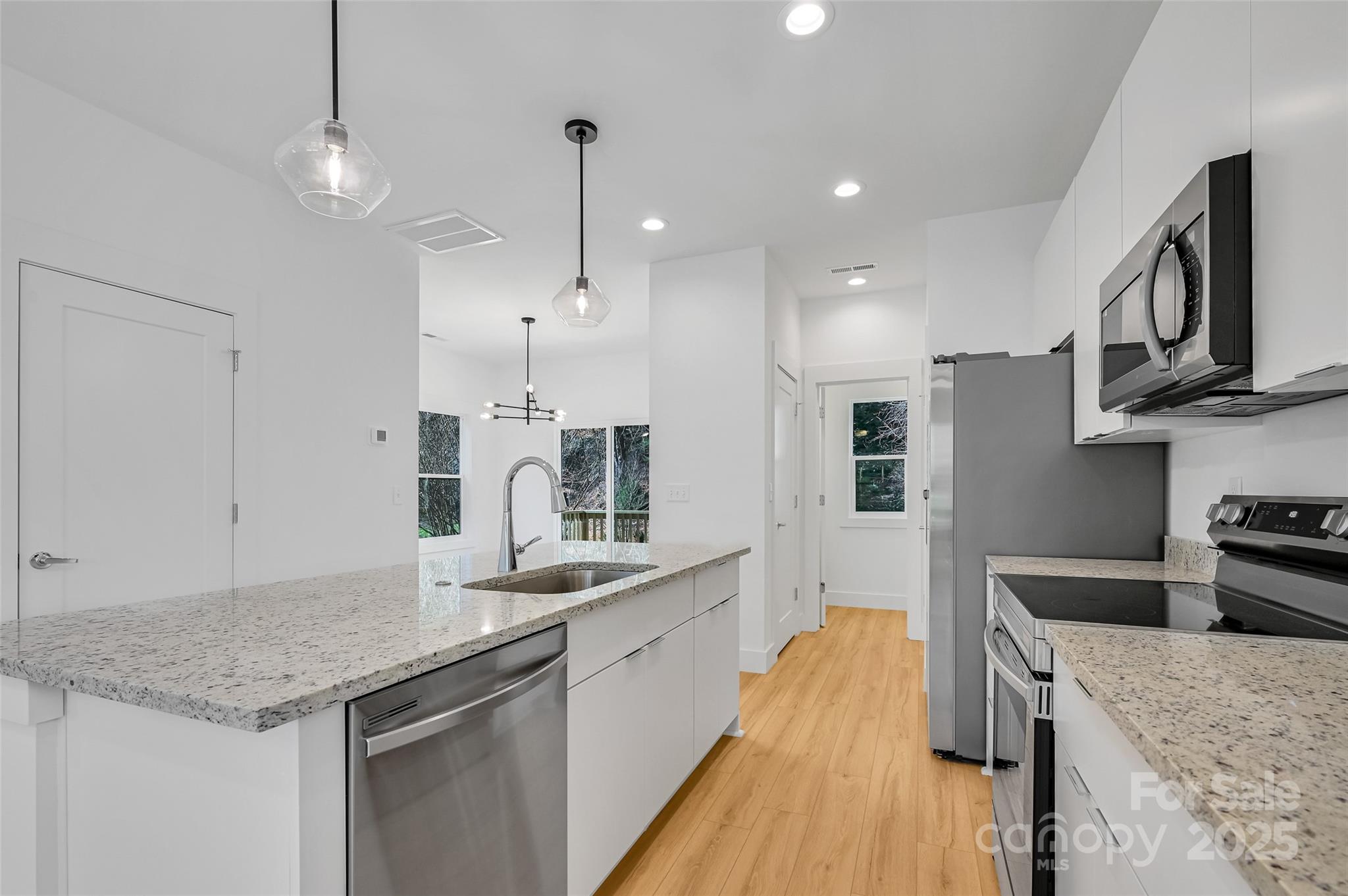 2 Cub Road Asheville, NC 28806 - Photo 8 of 24 a kitchen with stainless steel appliances granite countertop a sink stove and refrigerator