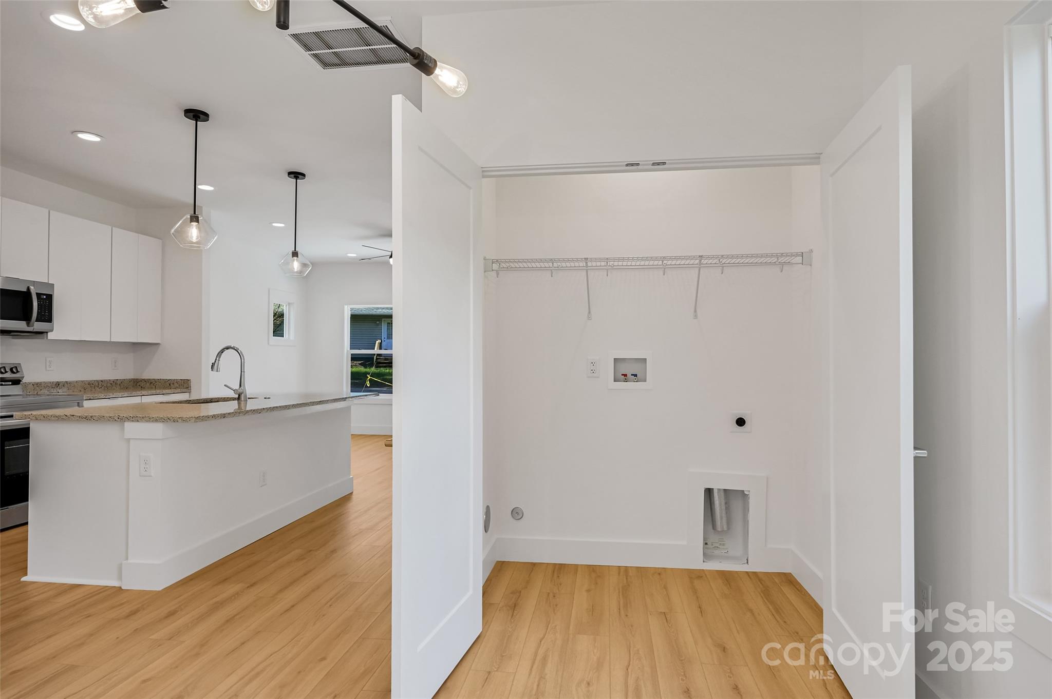 2 Cub Road Asheville, NC 28806 - Photo 10 of 24 a large kitchen with cabinets and wooden floor