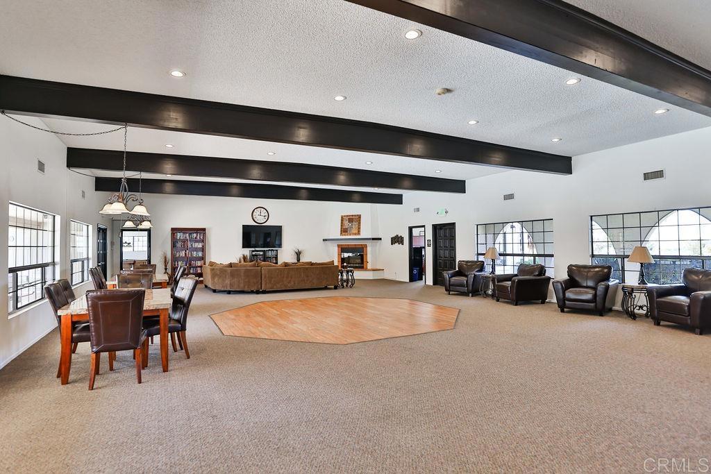 15935 Spring Oaks Road, Unit SPC 169 El Cajon, CA 92021 - Photo 20 of 24 a living room with furniture and a flat screen tv