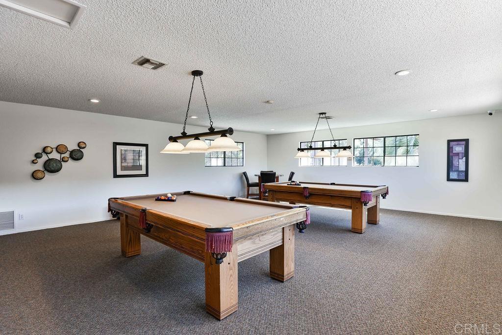 15935 Spring Oaks Road, Unit SPC 169 El Cajon, CA 92021 - Photo 21 of 24 a room with furniture pool table and windows