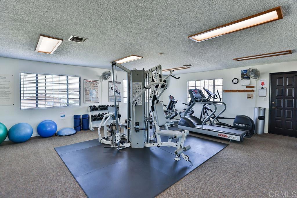 15935 Spring Oaks Road, Unit SPC 169 El Cajon, CA 92021 - Photo 23 of 24 a view of a room with gym equipment
