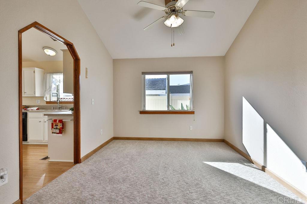 15935 Spring Oaks Road, Unit SPC 169 El Cajon, CA 92021 - Photo 5 of 24 an empty room with windows and fan