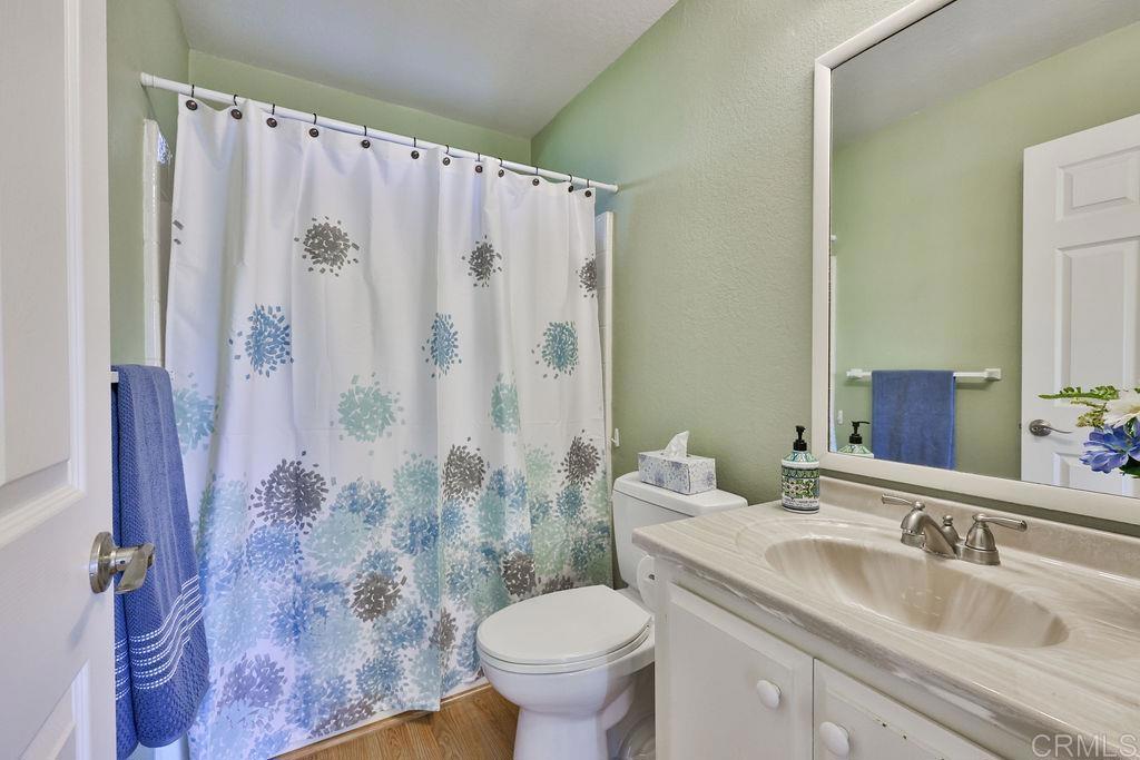 15935 Spring Oaks Road, Unit SPC 169 El Cajon, CA 92021 - Photo 7 of 24 a bathroom with a sink toilet and shower