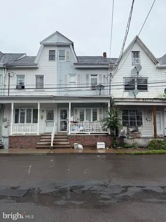 a front view of a building with lot of windows