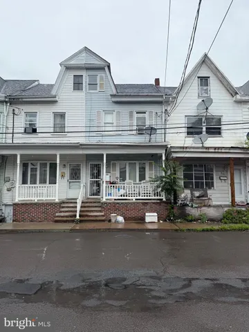 a front view of a building with lot of windows