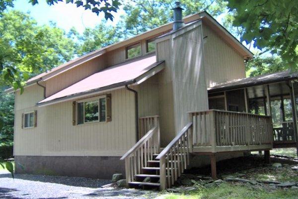 582 Bond Street Bushkill, PA 18324 - Photo 1 of 10 a front view of a house with deck