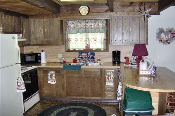 582 Bond Street Bushkill, PA 18324 - Photo 6 of 10 a kitchen with stainless steel appliances granite countertop a stove a sink and a refrigerator