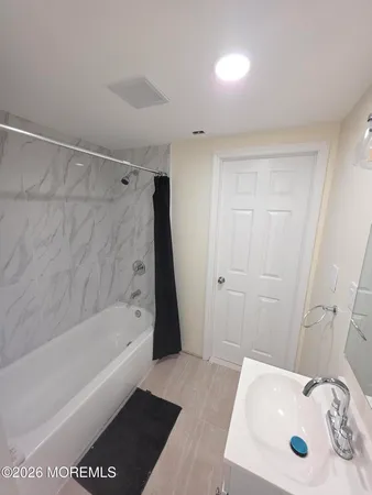 a bathroom with a sink and a tub
