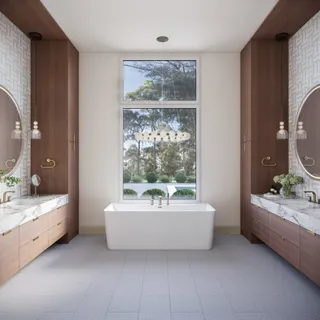 a bathroom with a bathtub a sink and a window