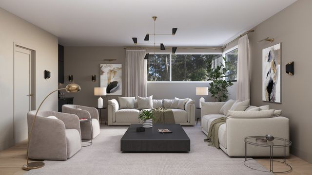 a living room with furniture a large window and a chandelier