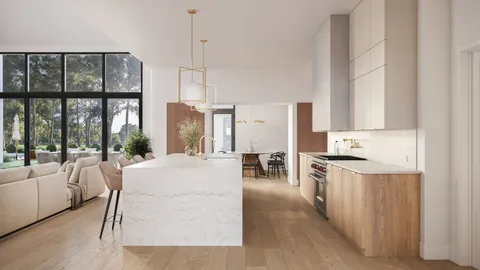 a living room with stainless steel appliances granite countertop furniture a fireplace and a large window