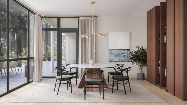a view of a dining room with furniture and window