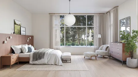 a bedroom with furniture and a large window