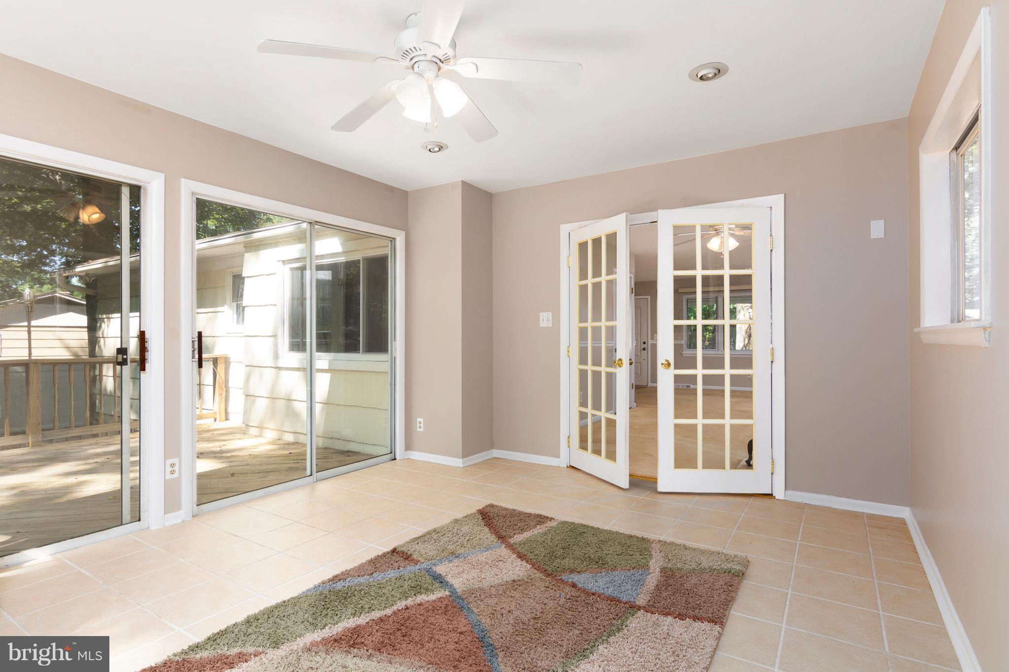 3737 Nile Road Davidsonville, MD 21035 - Photo 9 of 28 Sun room has sliders on 3 sides accessing the deck