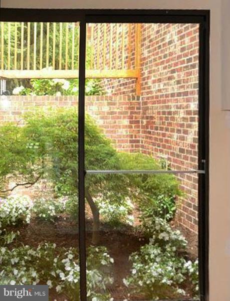 2129 Cabots Point Lane Reston, VA 20191 - Photo 8 of 29 SGD View from Kitchen to Courtyard