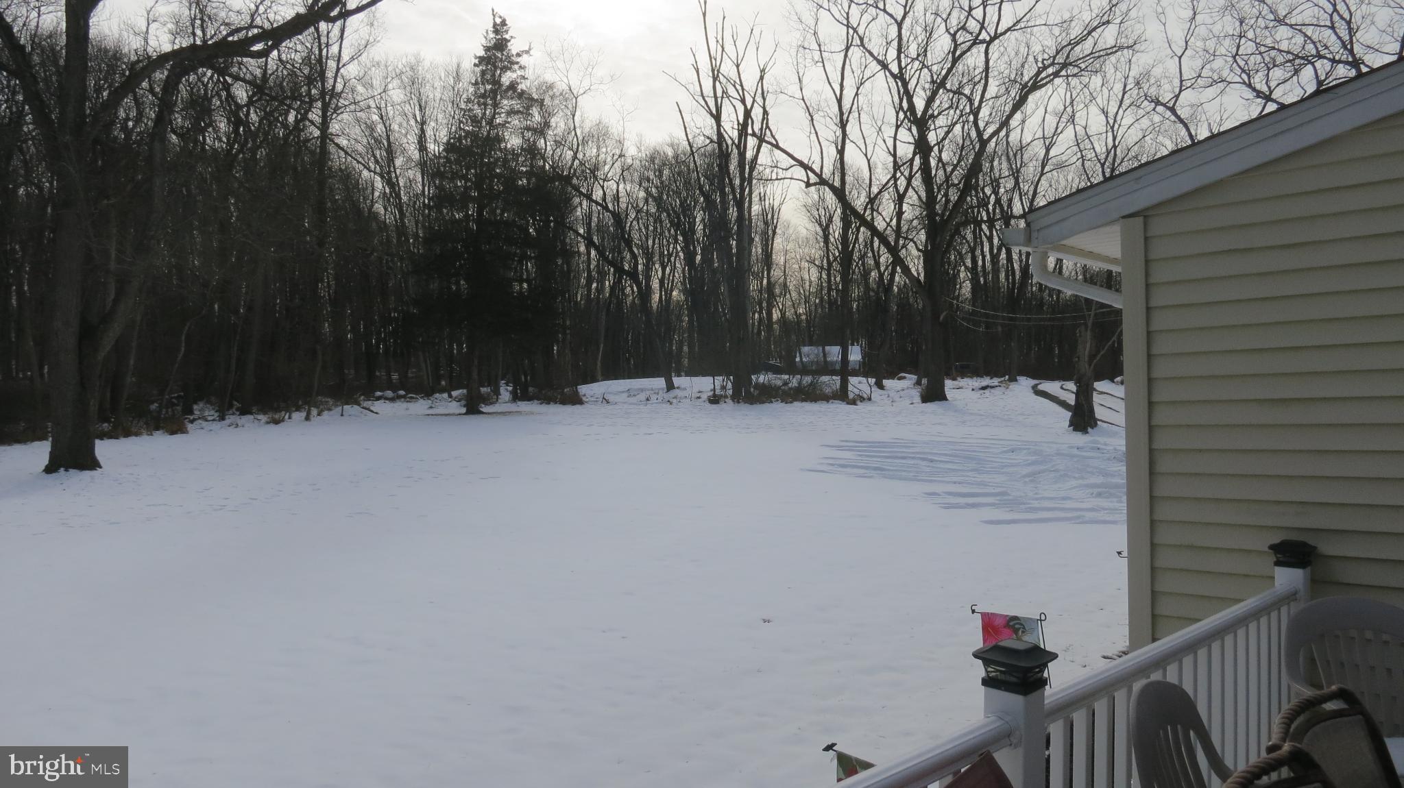 99 Lindbergh Road Hopewell, NJ 08525 - Photo 18 of 64 Serene winter landscape blanketed in snow.