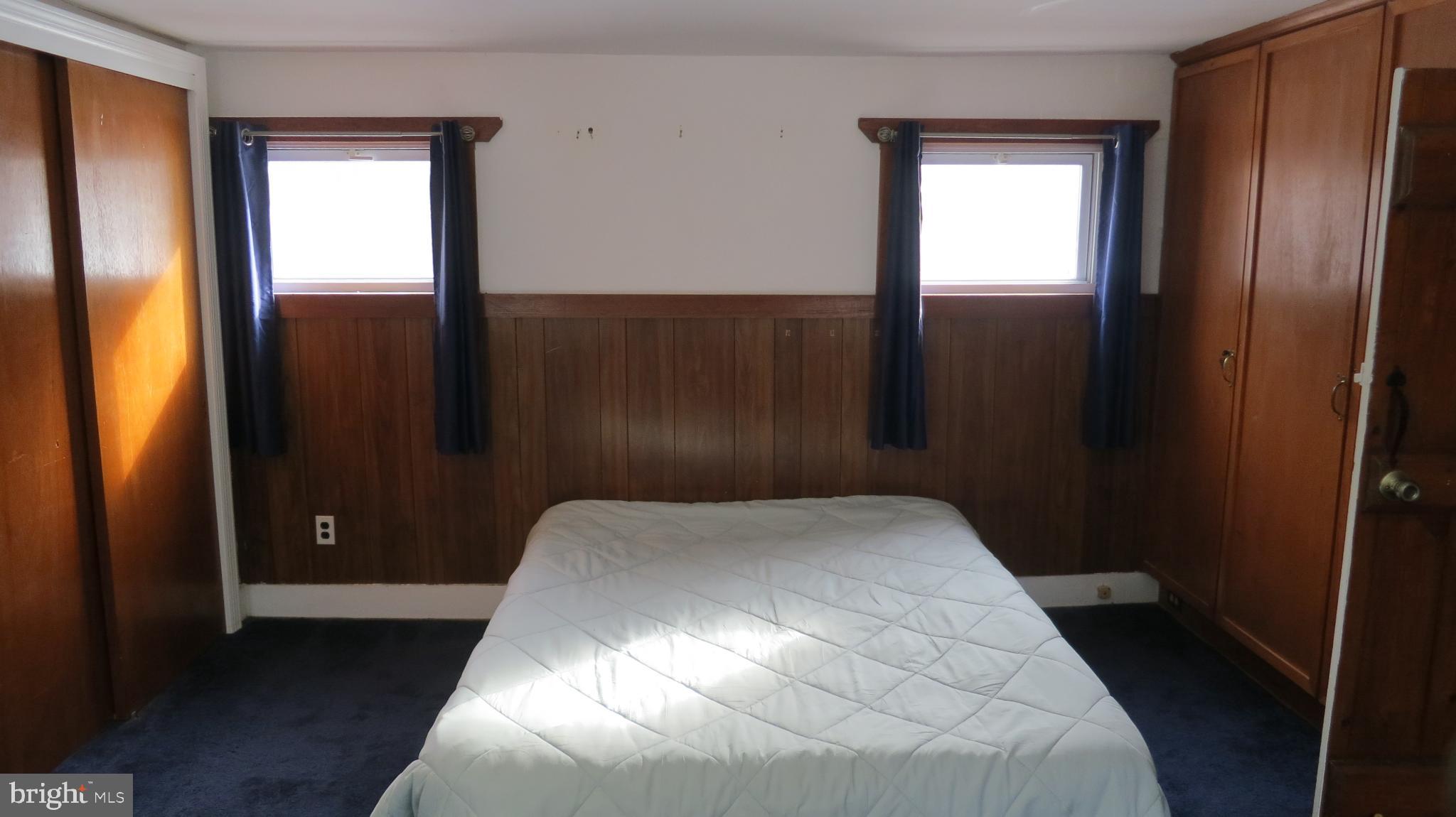 99 Lindbergh Road Hopewell, NJ 08525 - Photo 34 of 64 Cozy bedroom with warm wooden accents.