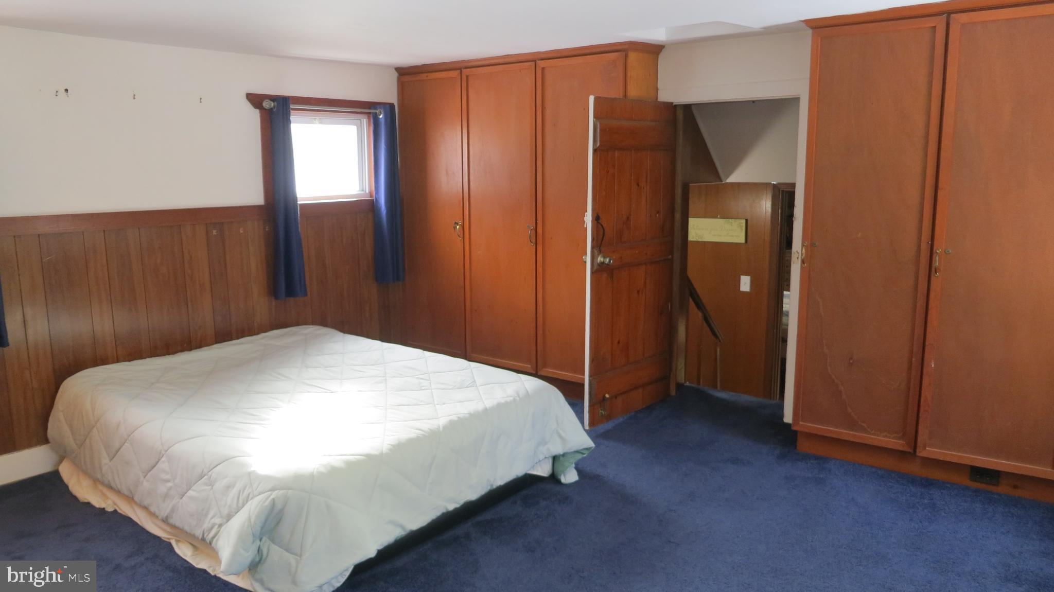 99 Lindbergh Road Hopewell, NJ 08525 - Photo 35 of 64 Spacious bedroom with warm wooden accents.